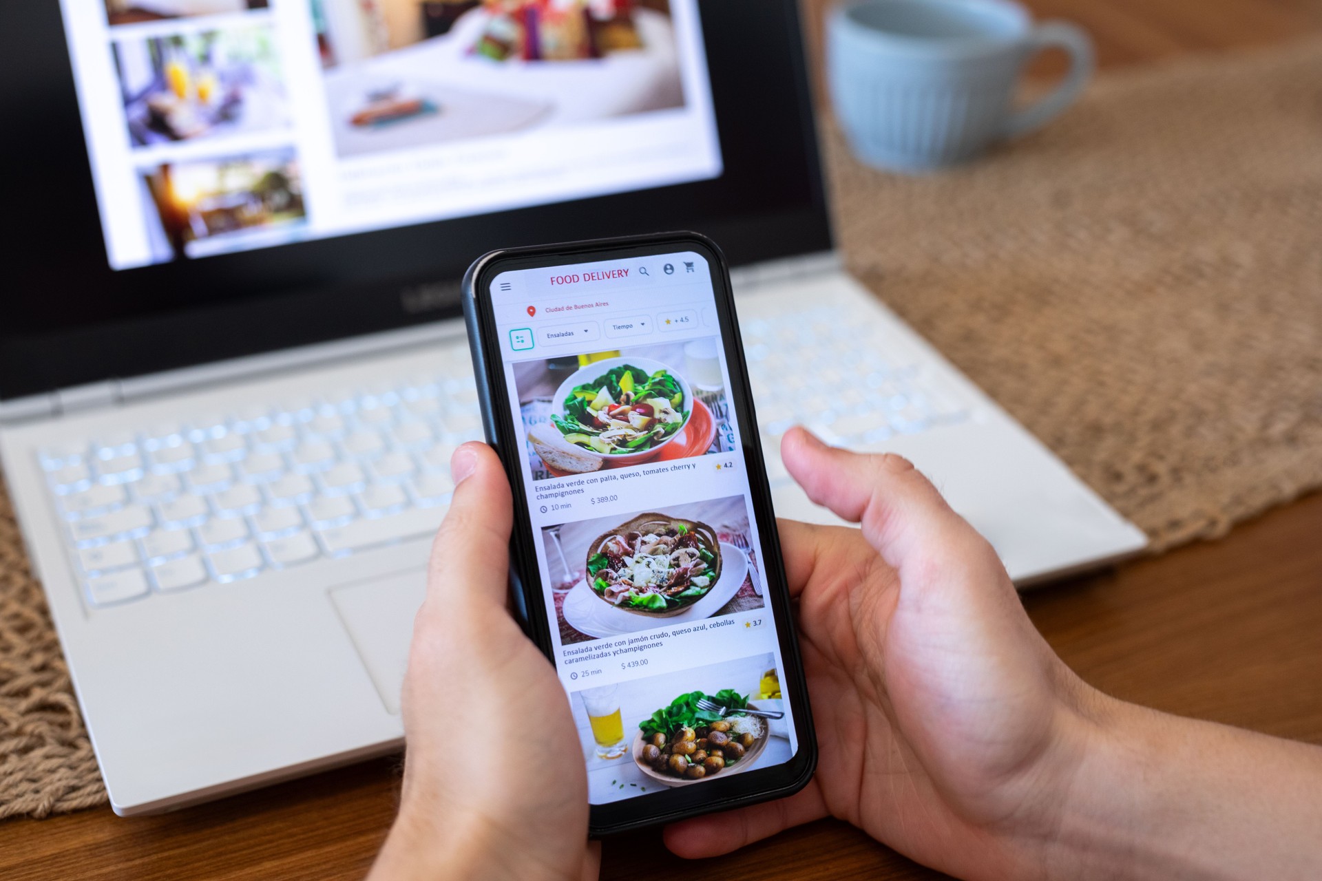 Unrecognizable person ordering food using smartphone